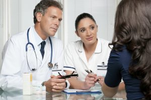 Photo Of Two Doctors Talking With A Patient - Carthage Area Hospital