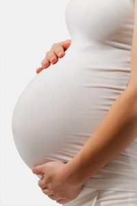 Photo Of A Pregnant Woman Cradling Her Stomach - Carthage Area Hospital