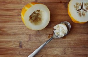 Partially cored squash with spoon