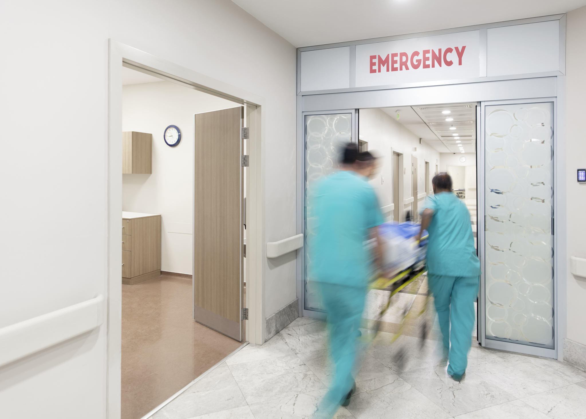 Nurses rushing patient to emergency room