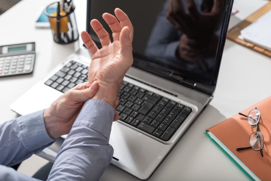 Businessman suffering from carpal tunnel