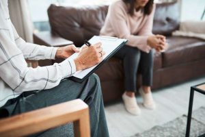 Behavioral health specialist talking with patient