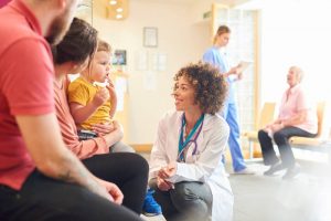 Doctor talking with family