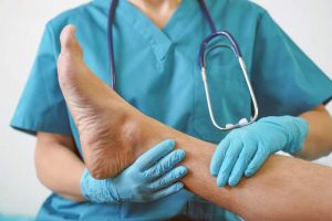 Podiatrist examining patient's foot