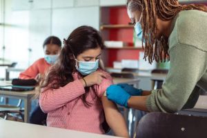 School nurse providing care to student