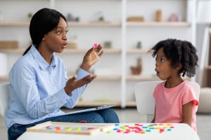 Mom teaching child how to prounce objects